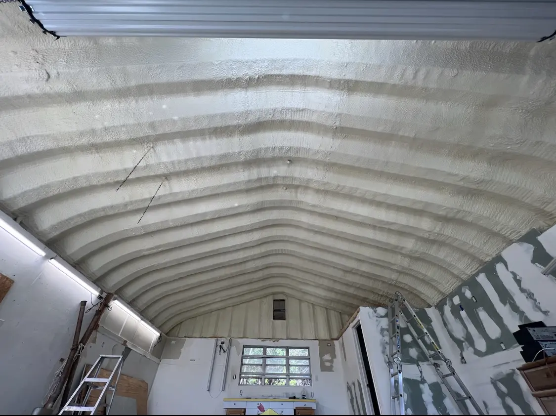 Spray polyurethane foam applied to the underside of a metal roof deck in Five Corners